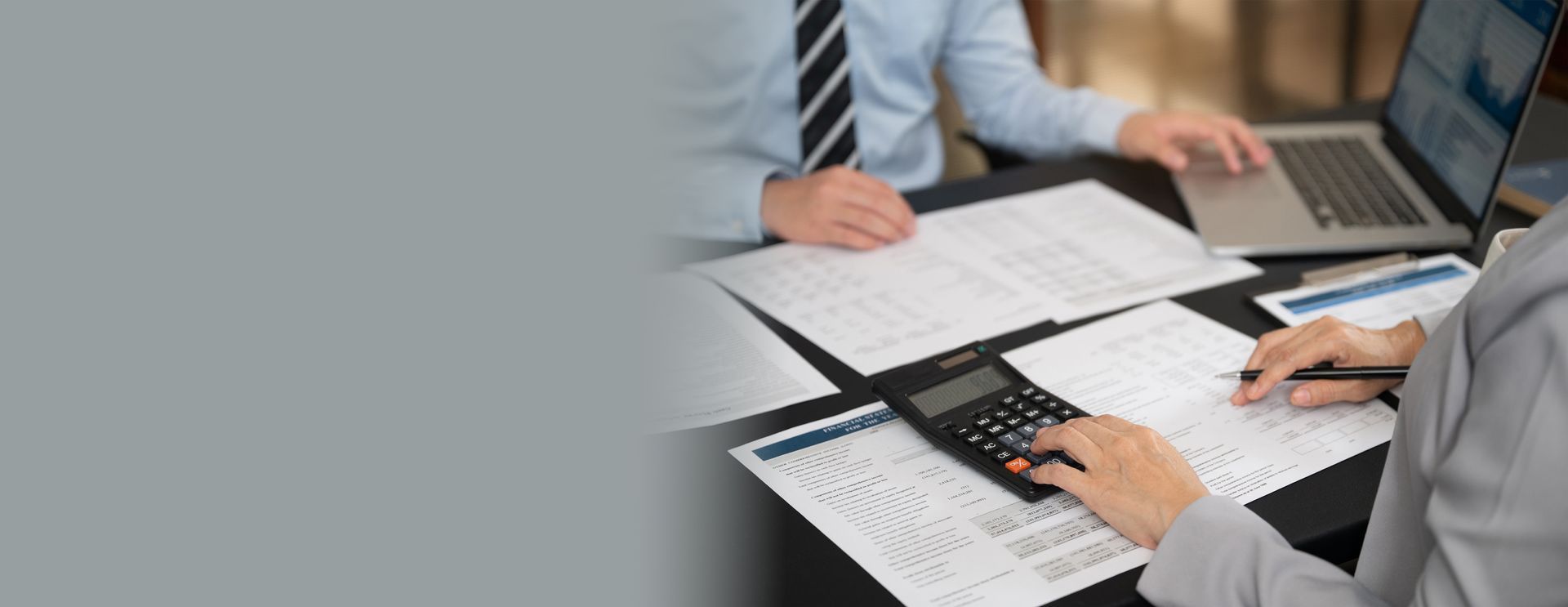 Tax Audit Firm reviewing IRS audit notice documents with a client.