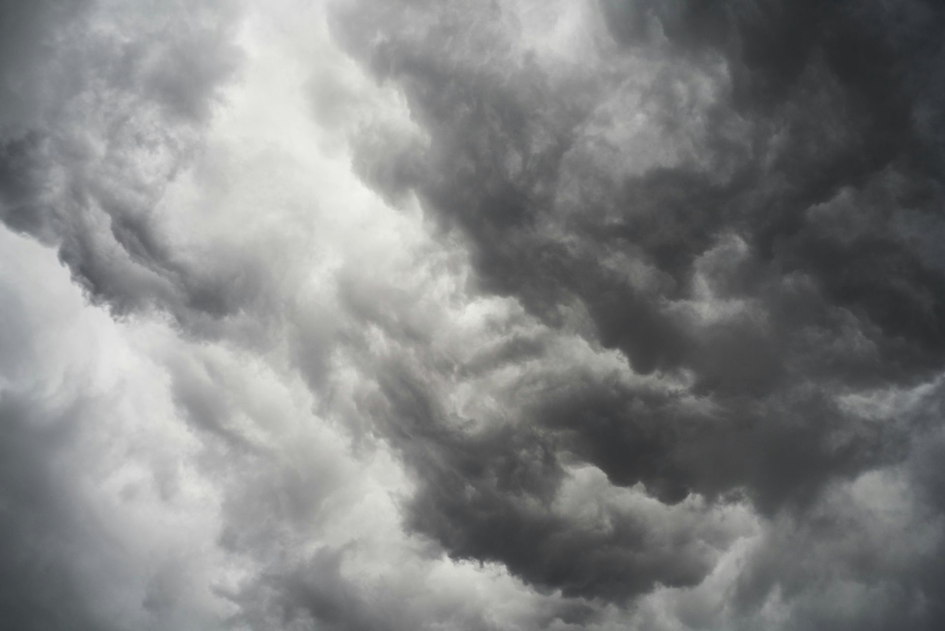 Dark, stormy clouds fill the sky, indicating an impending weather event.