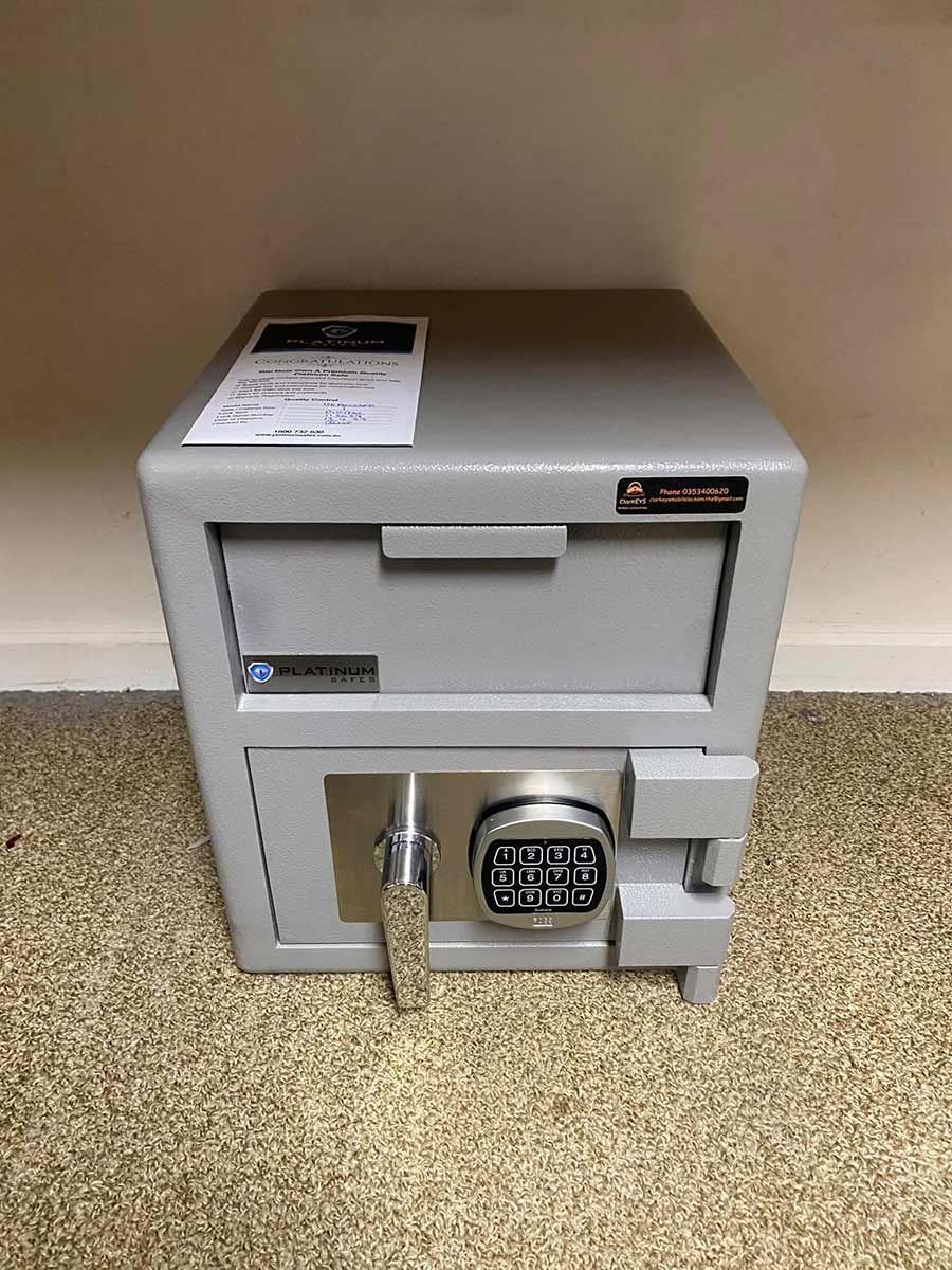 A Safe Is Sitting On Top Of A Carpeted Floor Next To A Wall — ClarKEYS Mobile Locksmiths In Winter Valley, VIC