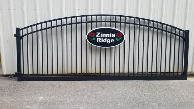 Black metal gate with arched top and 