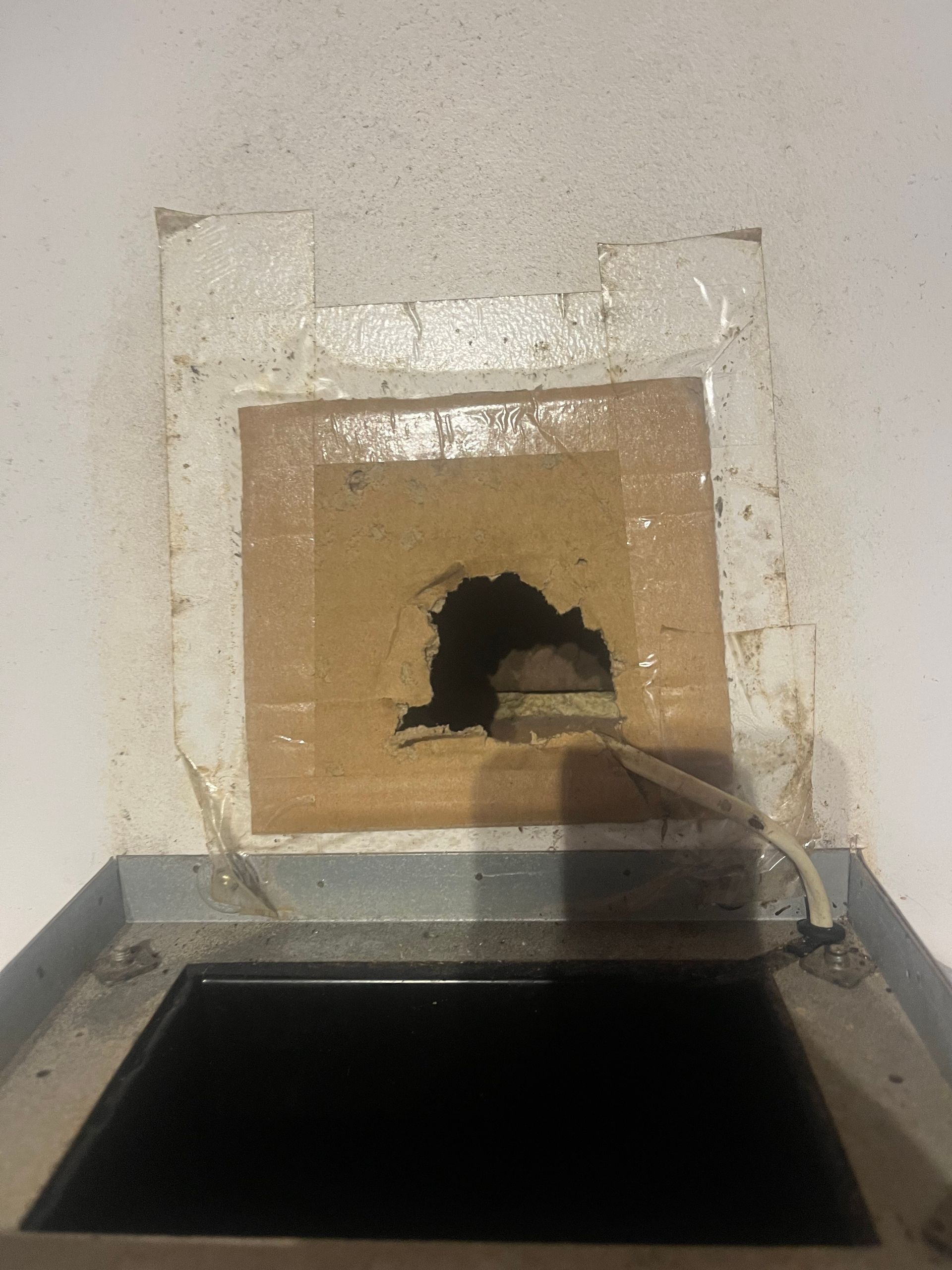 an open hole above stove exhaust letting rats in before photo rodent inspection in Port Macquarie.