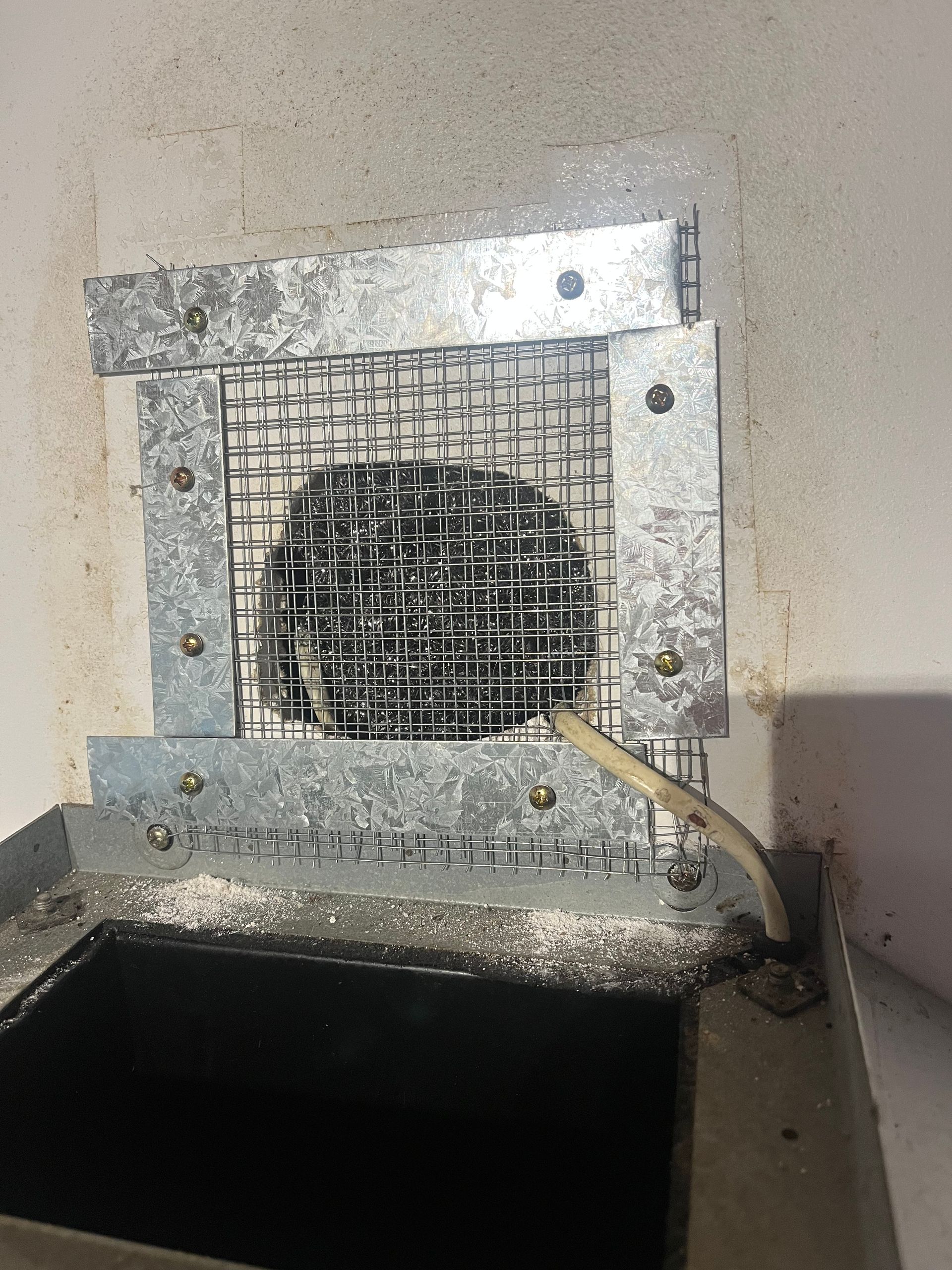 a proofed sealed hole above stove exhaust using stainless steel pest mesh and Aluminium bracing in before photo rodent inspection in Port Macquarie.