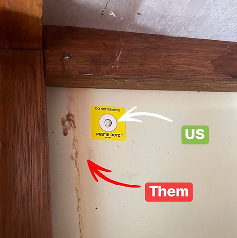 Yellow “Do Not Remove” sticker on beige wall under a wooden beam, marked “Then” with a red arrow pointing left.
