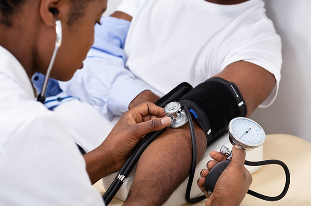 Healthcare Professional Taking a Patient's Blood Pressure — NatureWise Pest Control In Port Macquarie, NSW