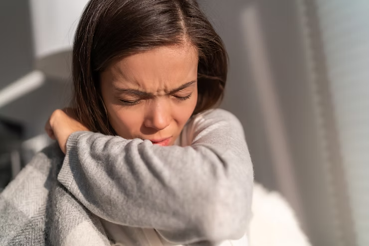 Woman Coughing Into Her Elbow — NatureWise Pest Control In Port Macquarie, NSW
