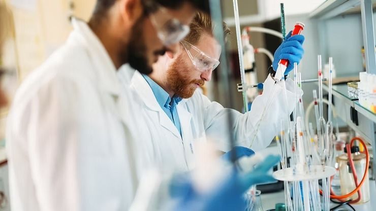 Two Scientists in Lab Coats and Safety Glasses — NatureWise Pest Control In Port Macquarie, NSW