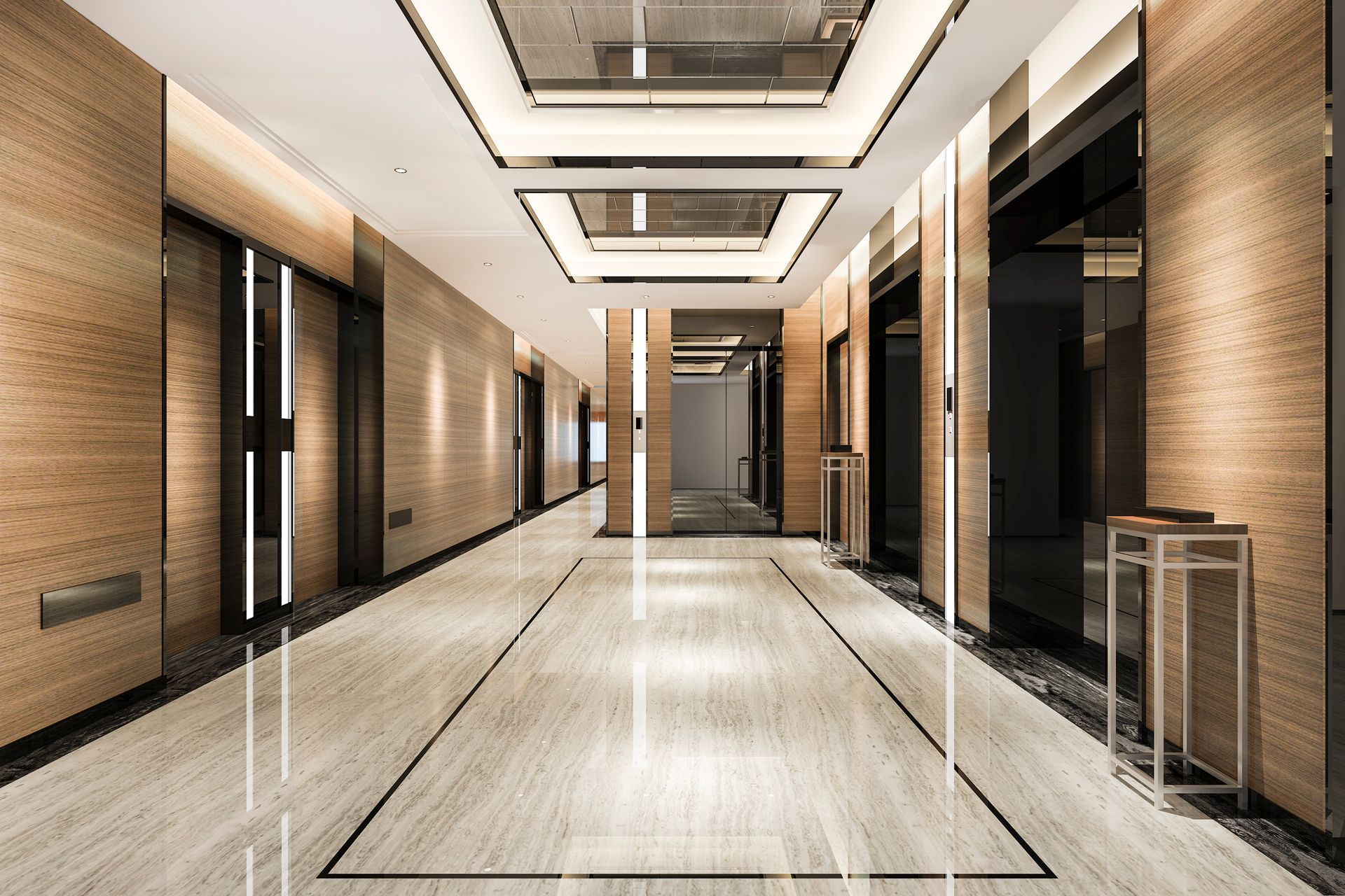 Long, modern hallway with marble floors, wood paneling, recessed lighting, and elevators.