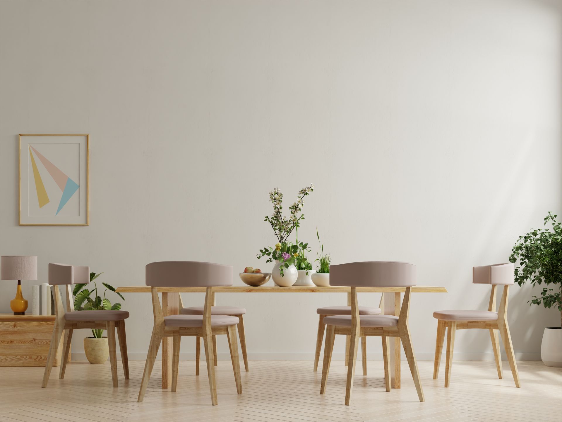 Minimalist dining room with light wood table, four chairs, plants, and framed wall art on a white wall Minimalist dining room with light wood table, four chairs, plants, and framed wall art on a white wall