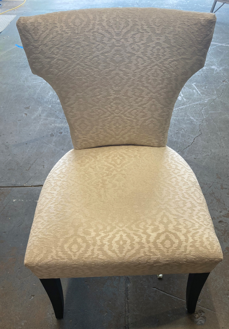 A chair sitting on a concrete floor.