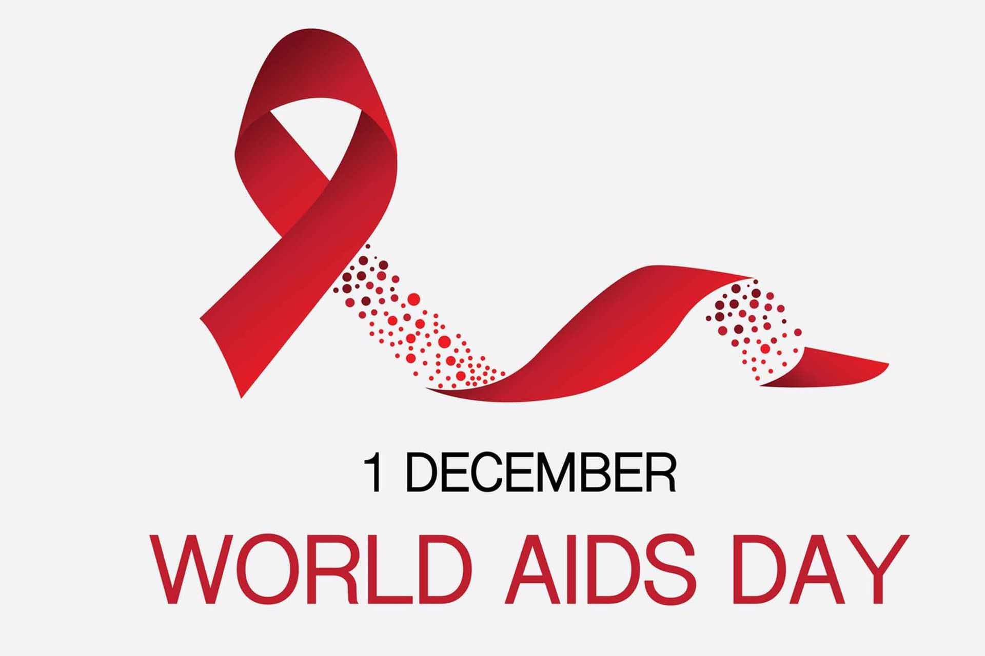 A red ribbon is on a white background for World Aids Day. A red ribbon is on a white background for World Aids Day.