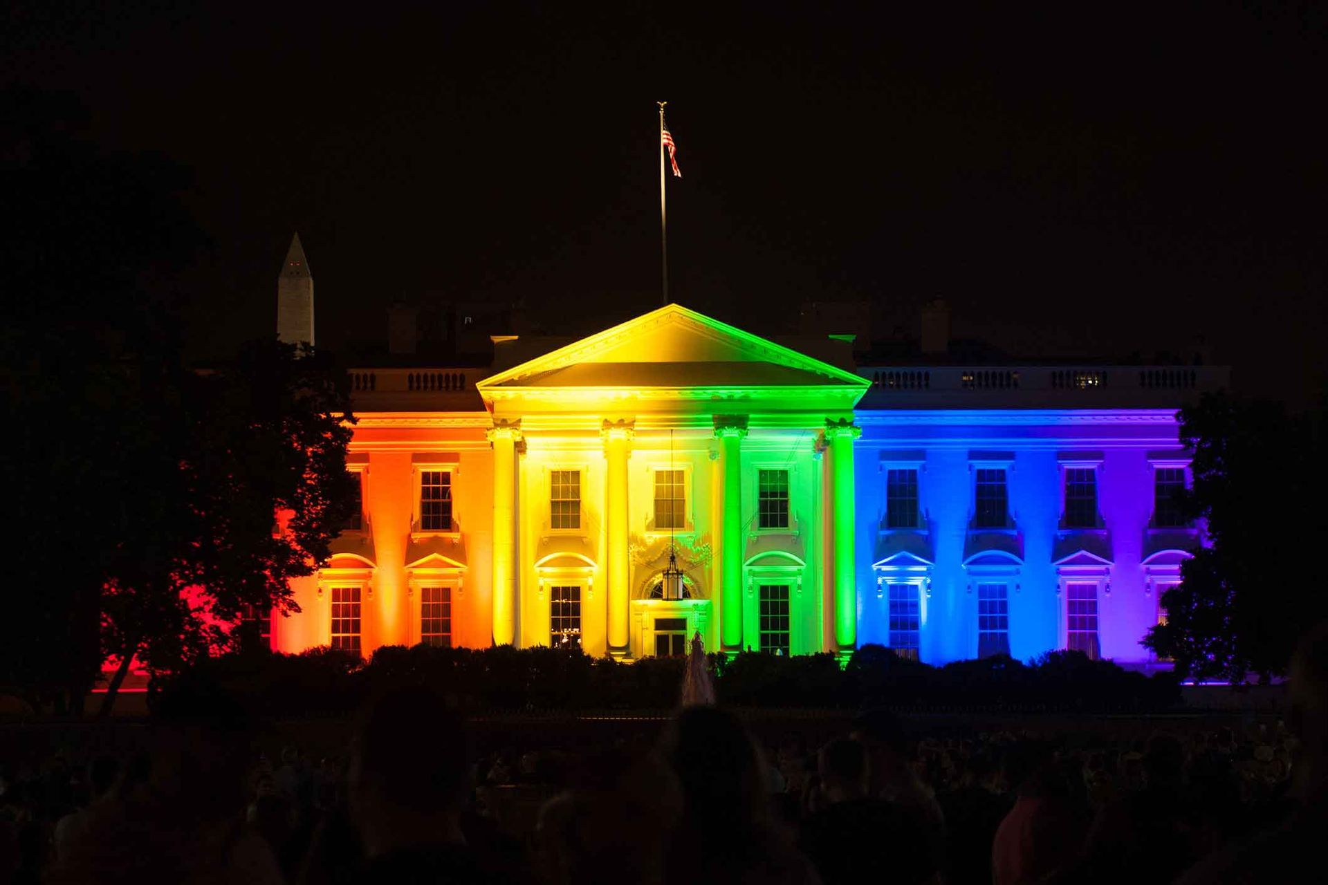 The White House is lit up in rainbow colors at night The White House is lit up in rainbow colors at night