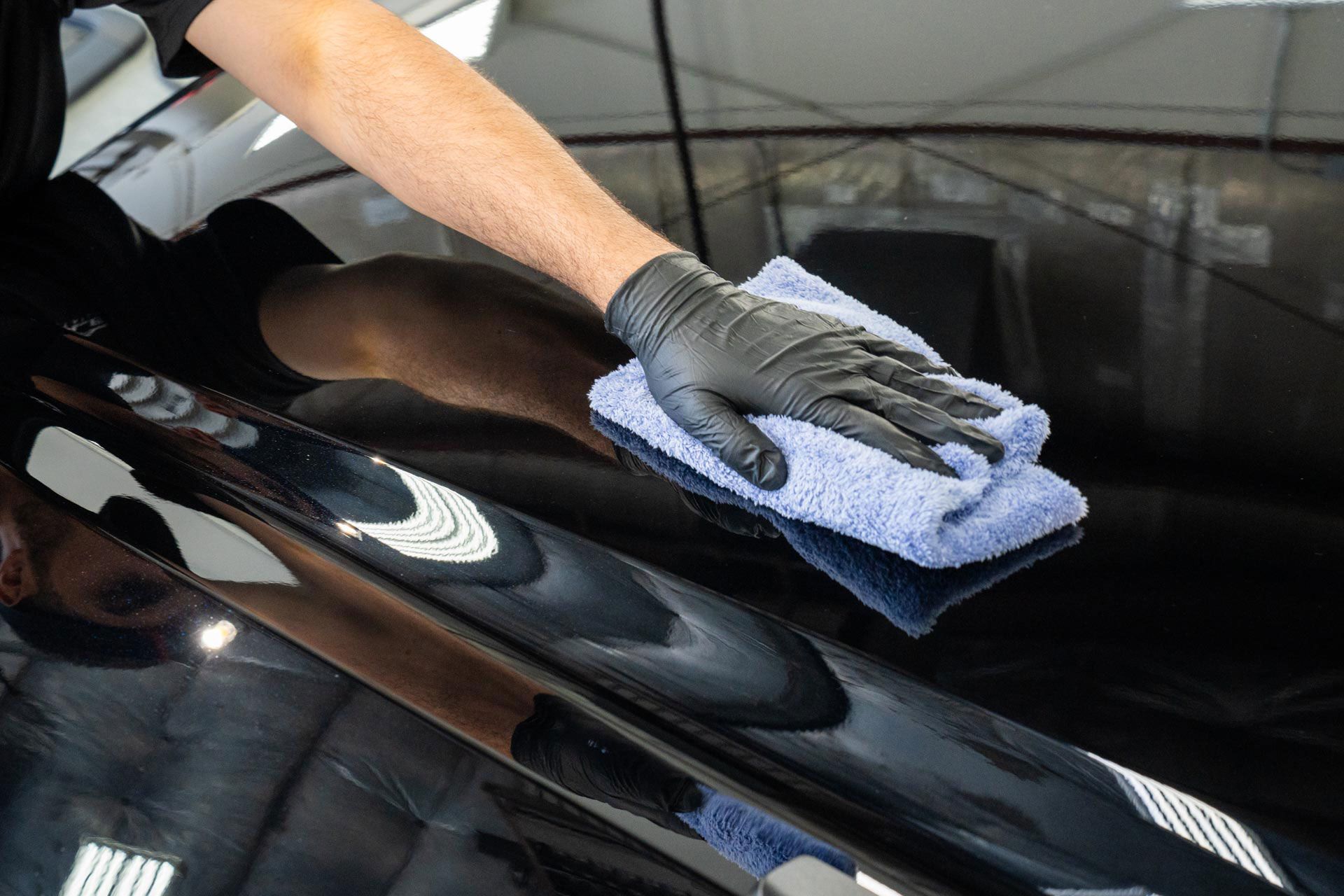ceramic coating application on a black car