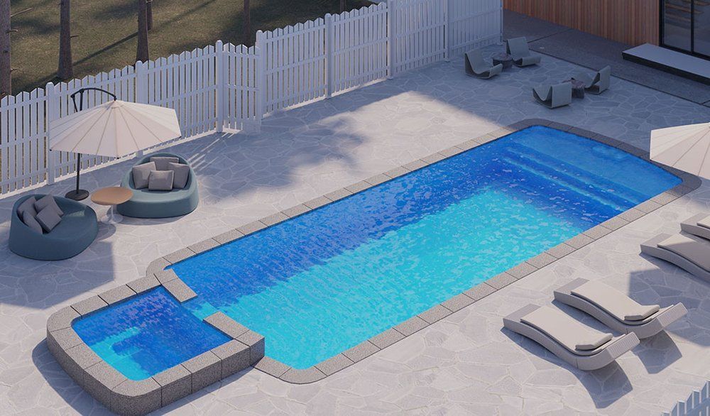 An aerial view of a large swimming pool surrounded by chairs and umbrellas.