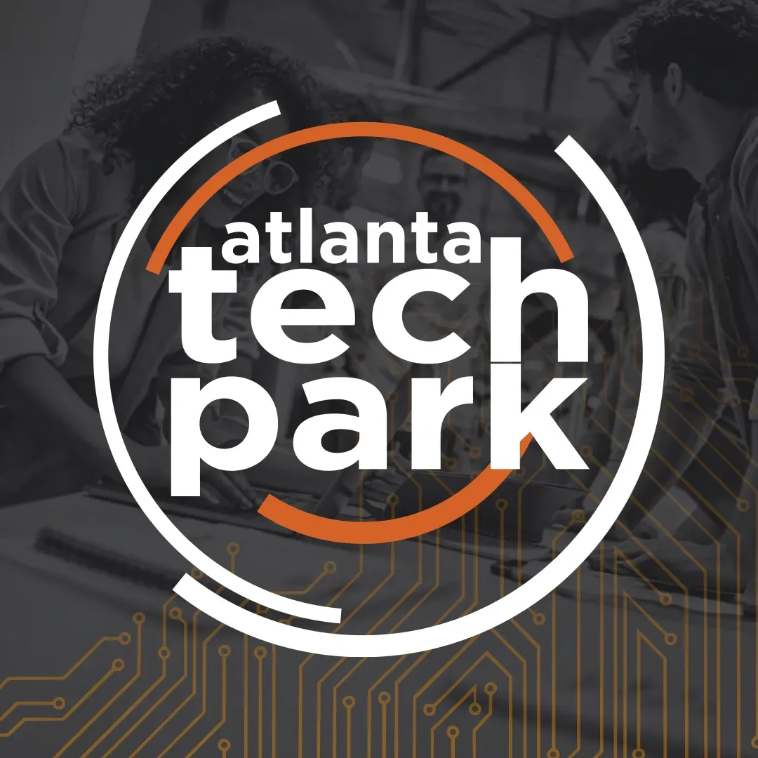 Atlanta Tech Park logo in white and orange on a dark tech-themed background