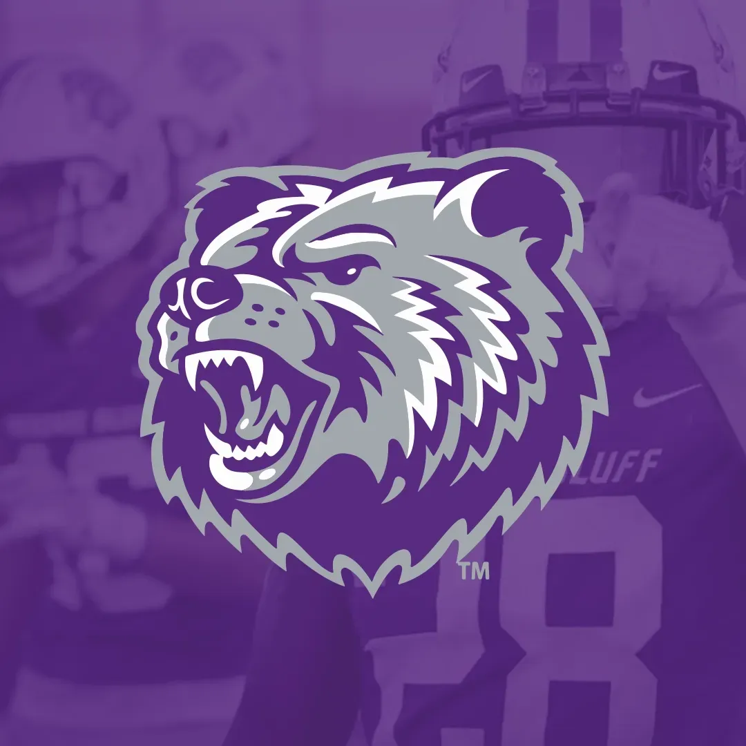 Purple bear head sports logo over a football player background