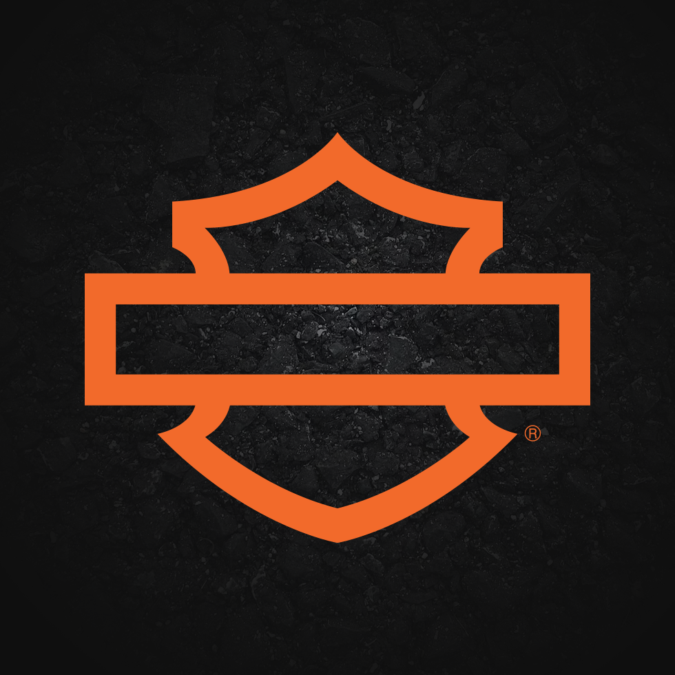 Orange Harley-Davidson shield logo on a dark textured background