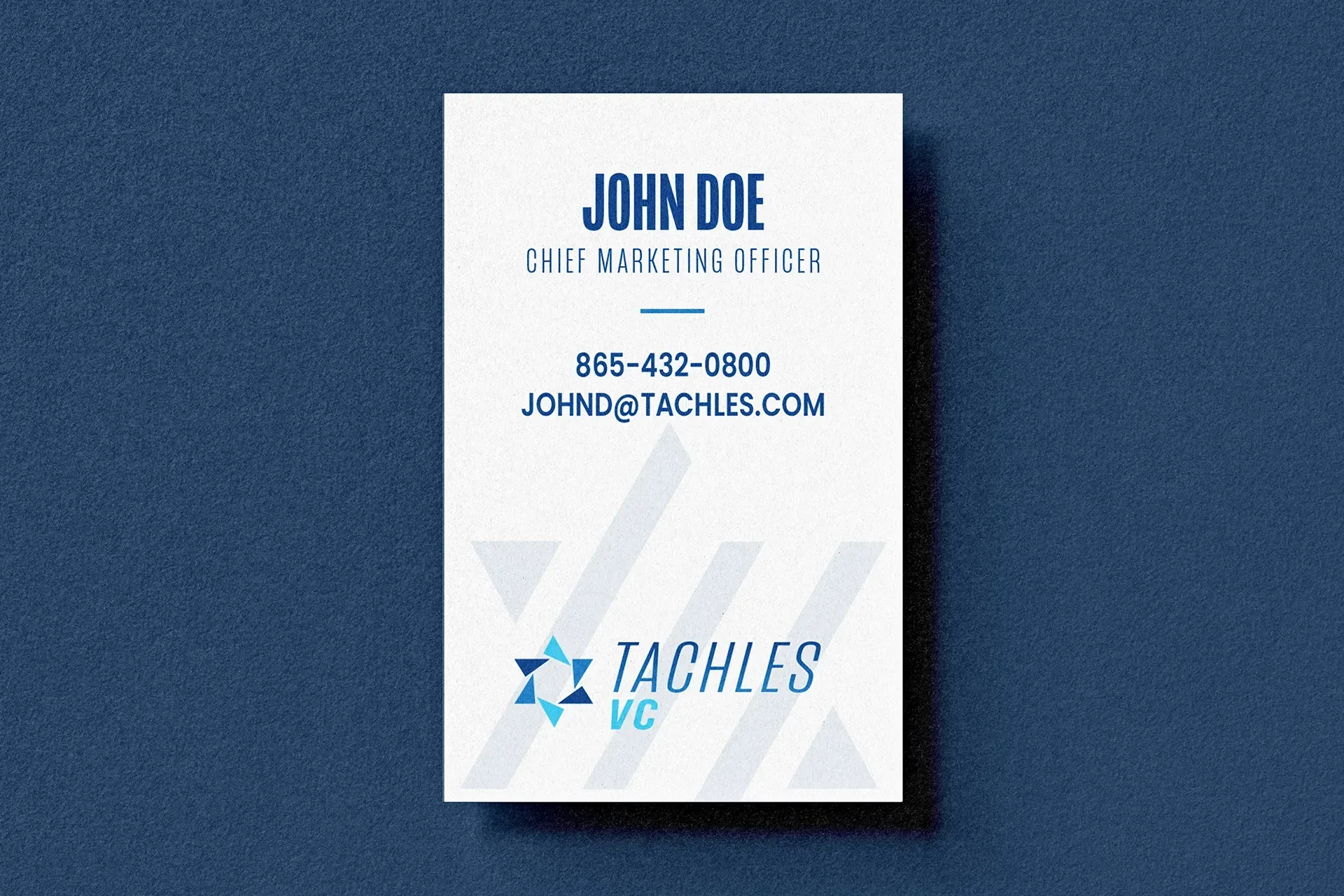 Blue-and-white business card for John Doe with contact details and Taches logo on textured blue background