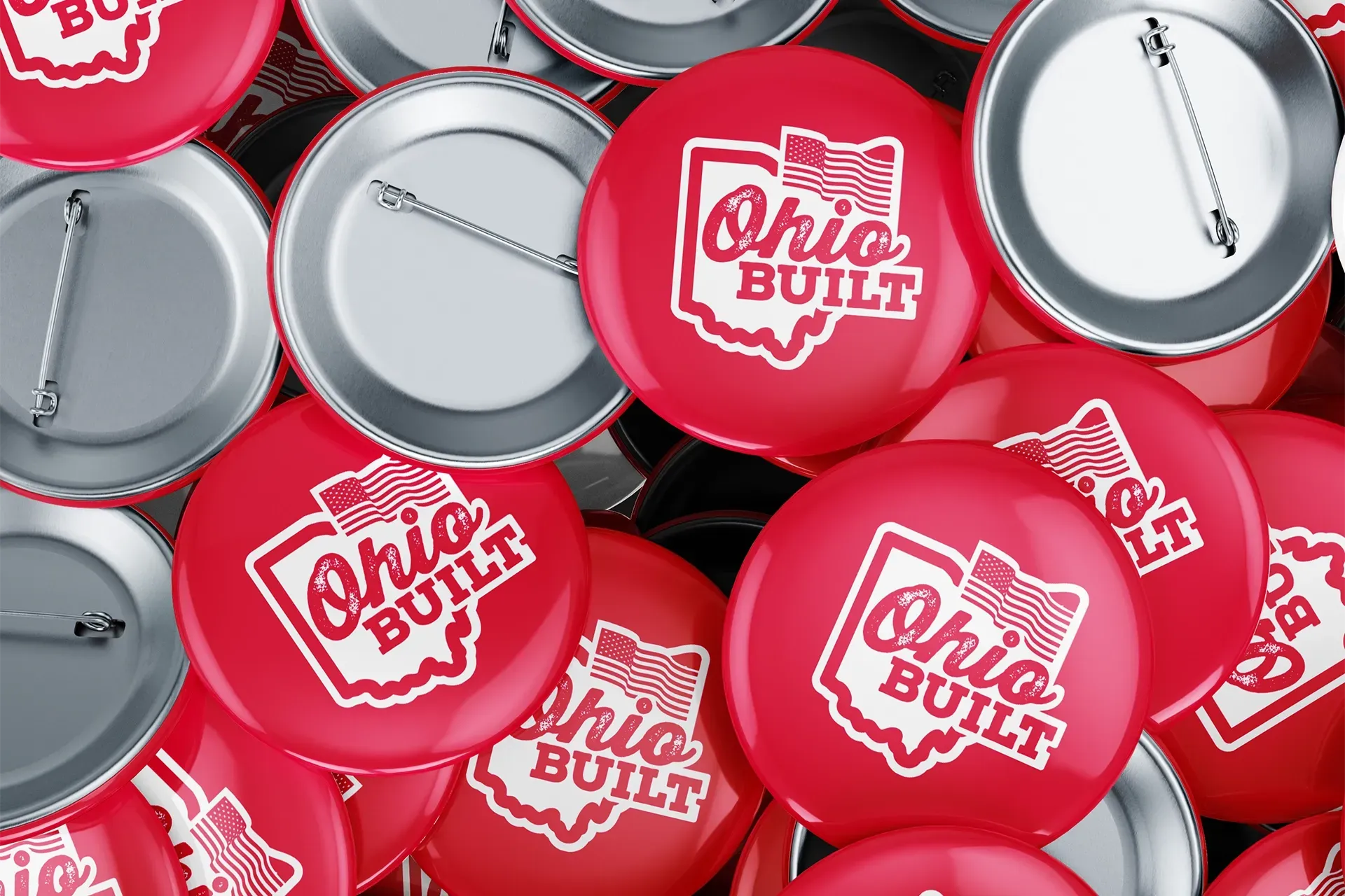 Red and silver buttons with the Ohio Built logo scattered in a pile
