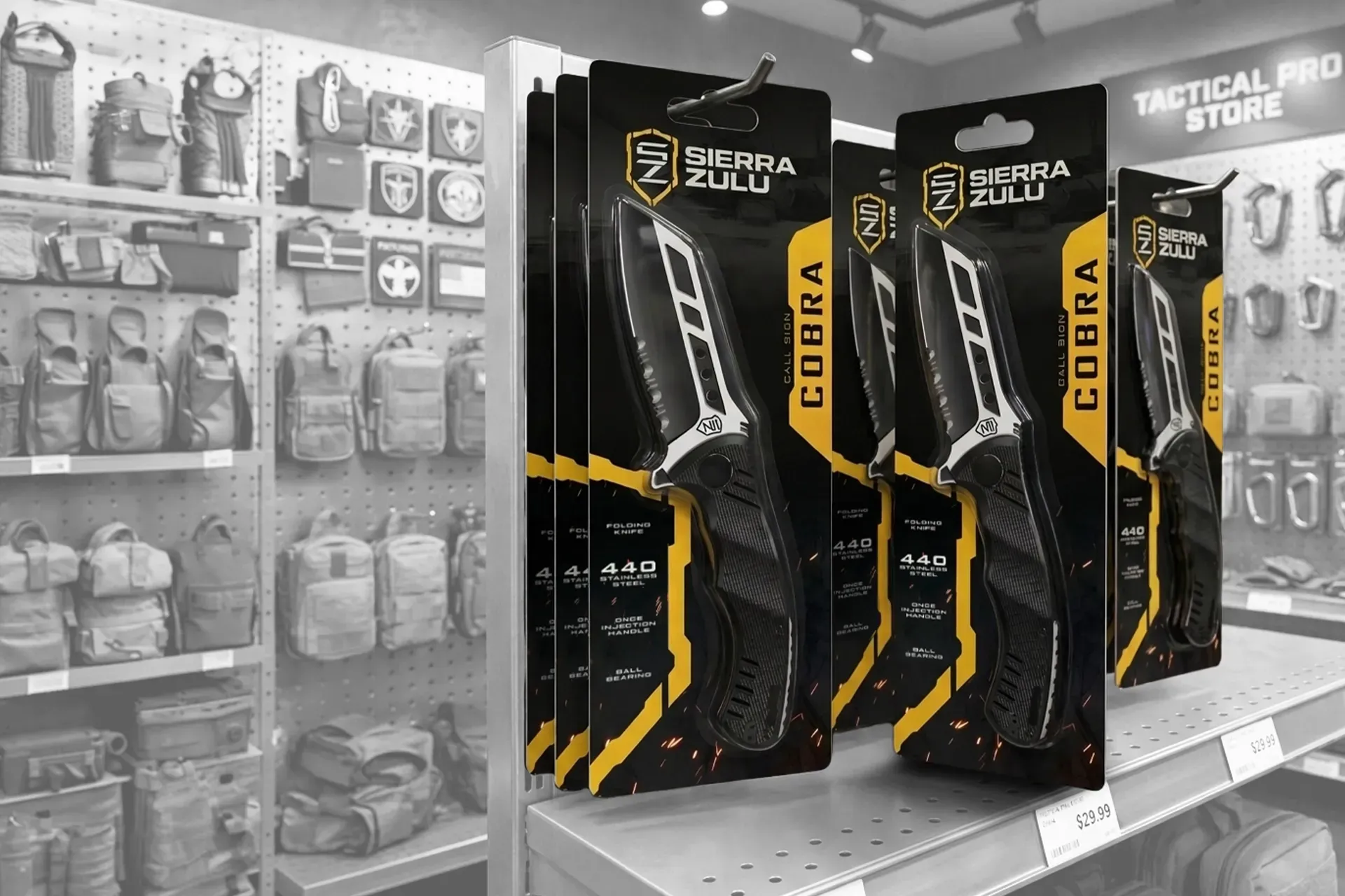 Store shelf with packaged tactical knives in black and yellow display boxes among other hanging tools