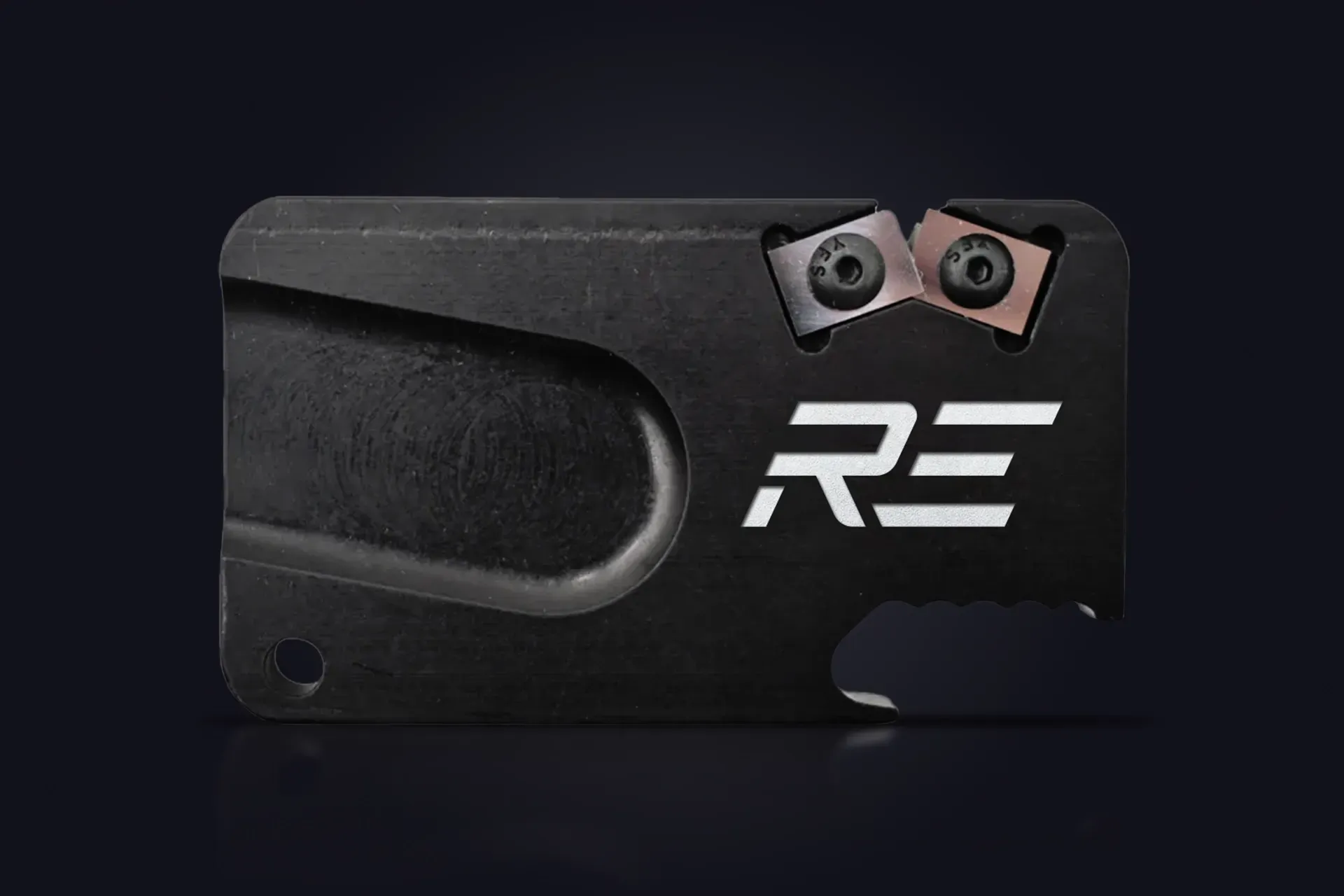 Black rectangular metal plate with two bolts and white “RS” logo on a dark background