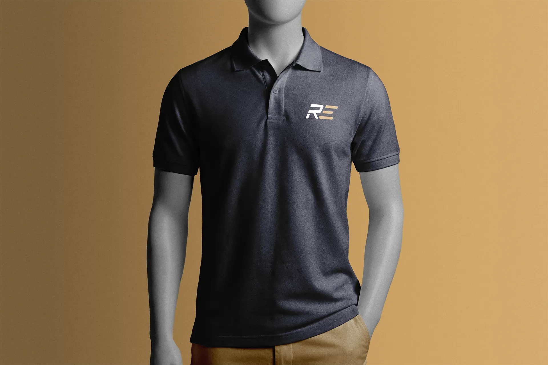 Gray polo shirt with white logo on mannequin against tan background