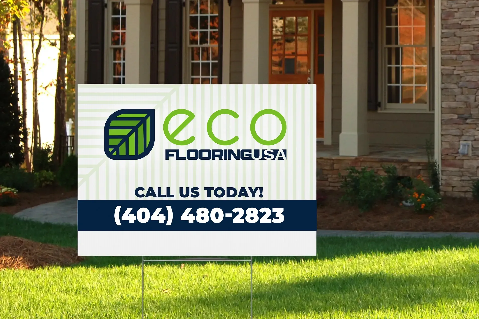 Eco Flooring sign on a lawn in front of a brick house, with phone number (404) 480-2823.