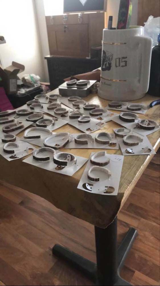 A table with a lot of pieces of paper on it.