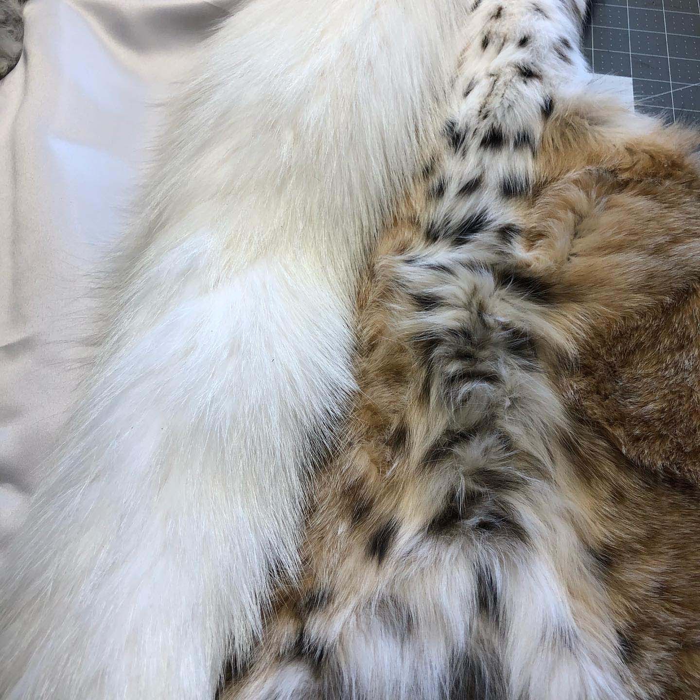 A close up of a fur coat with a leopard print.