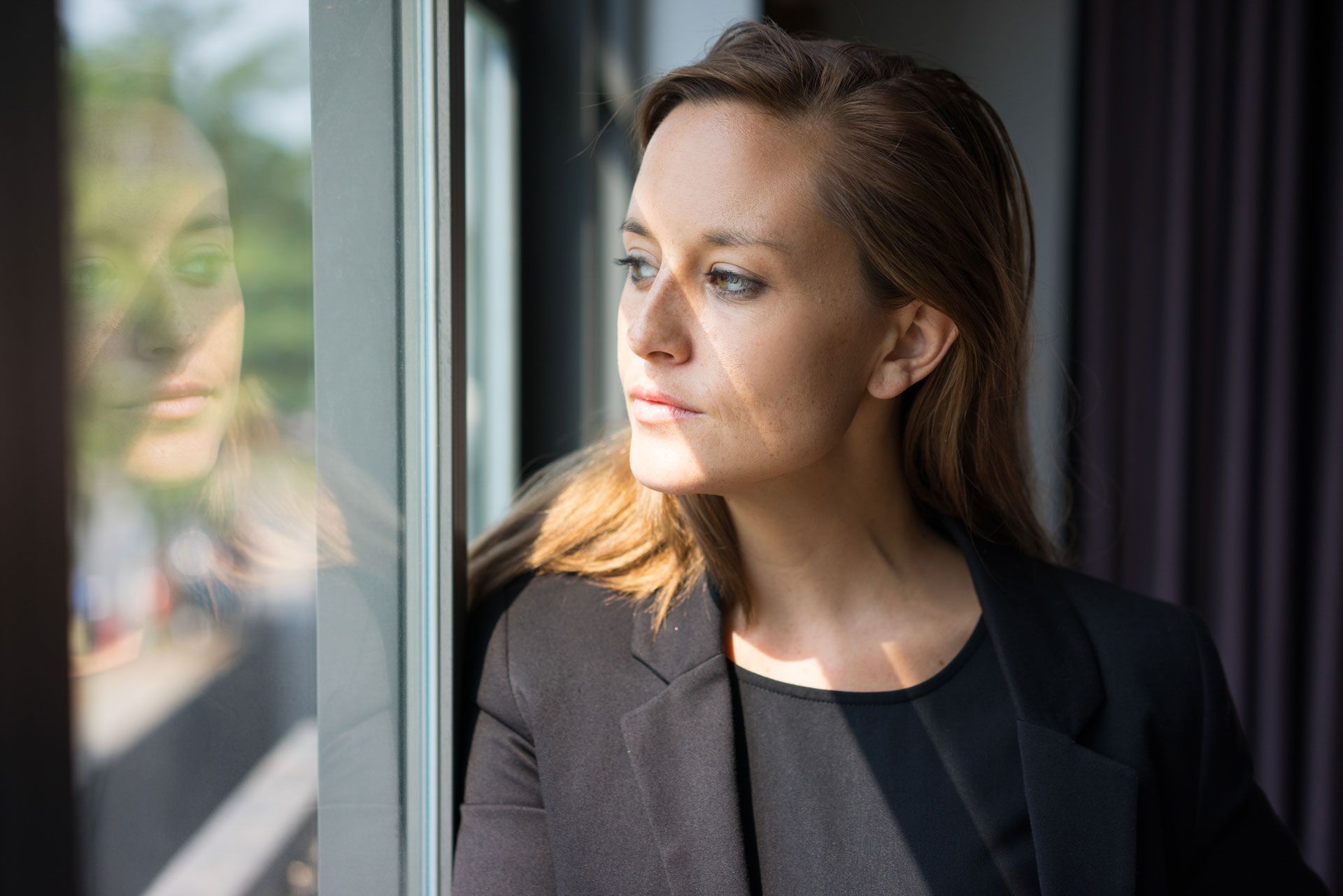 Woman looking through the window