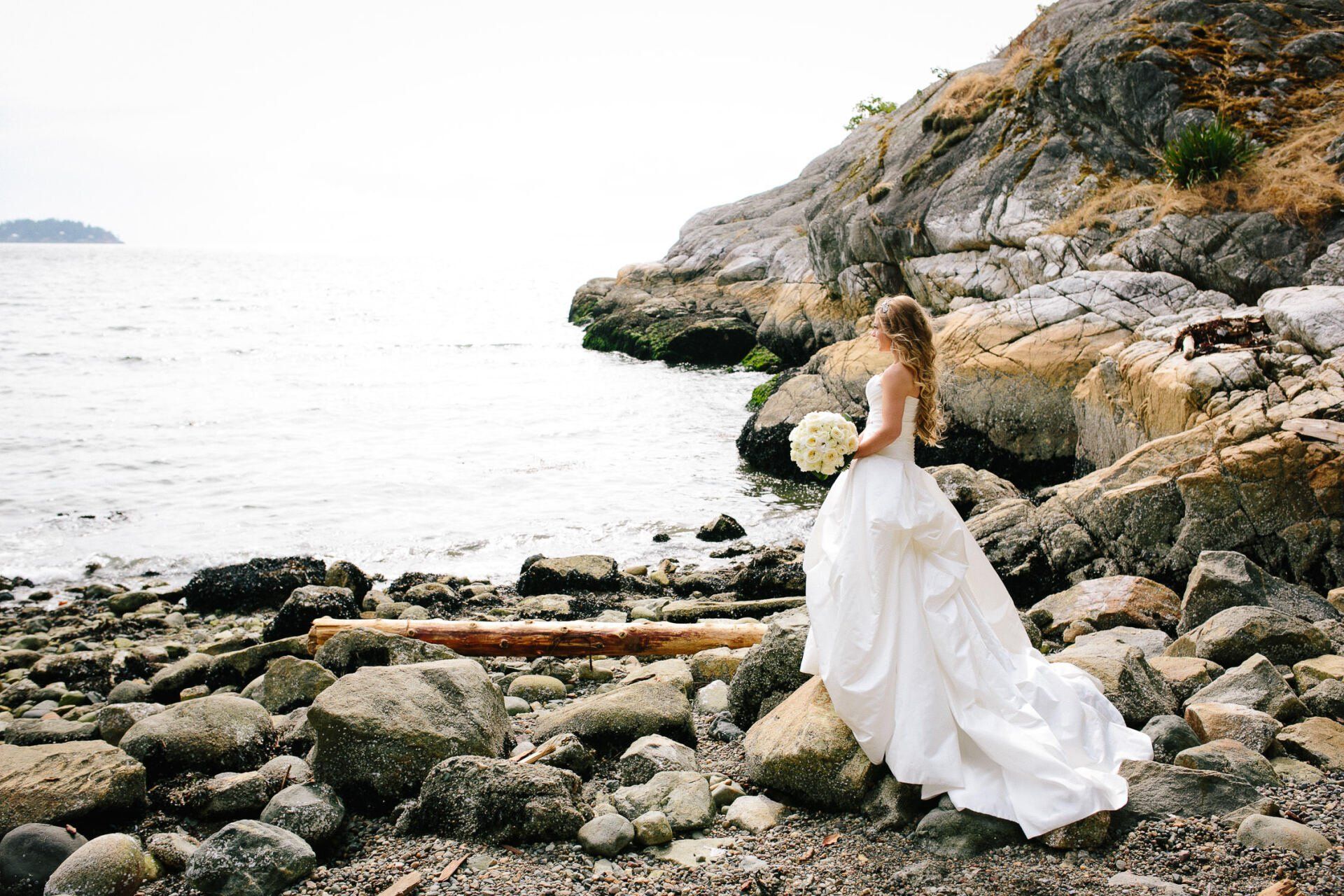 Bride looking out at the ocean