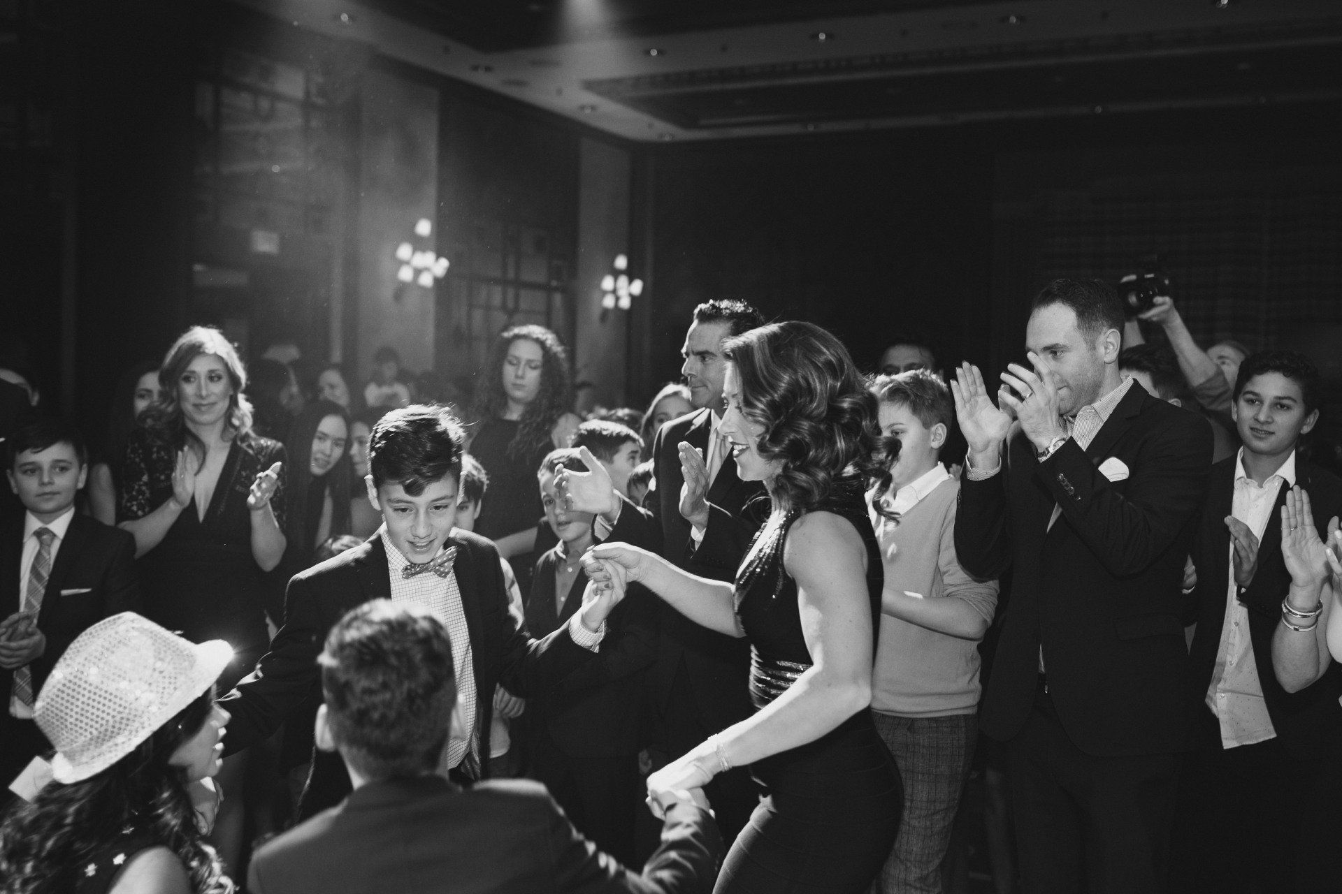 Black and white photo of people dancing at a party