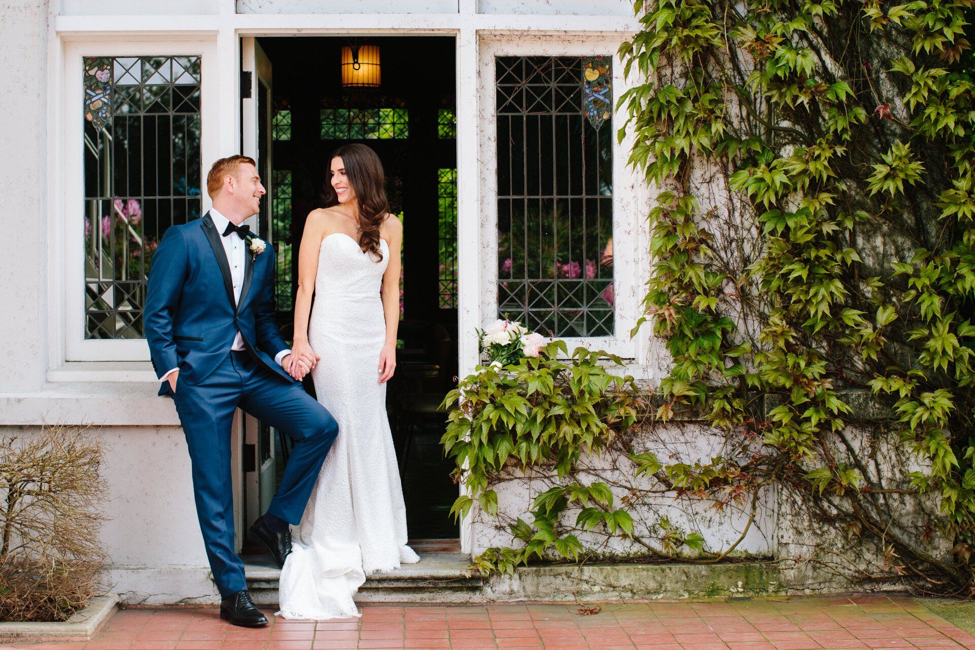 Bride and groom holding hands
