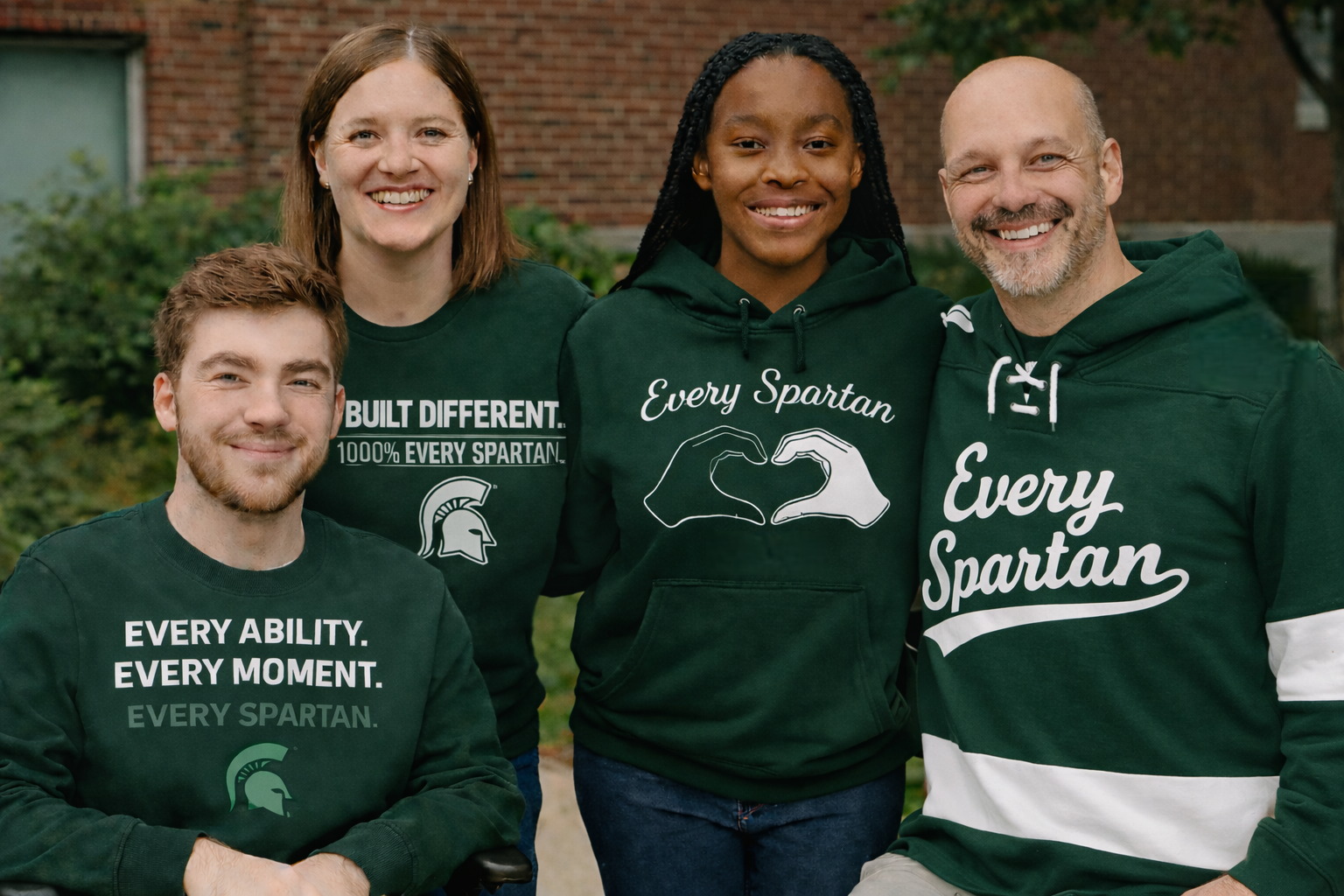 Group of four people wearing green
