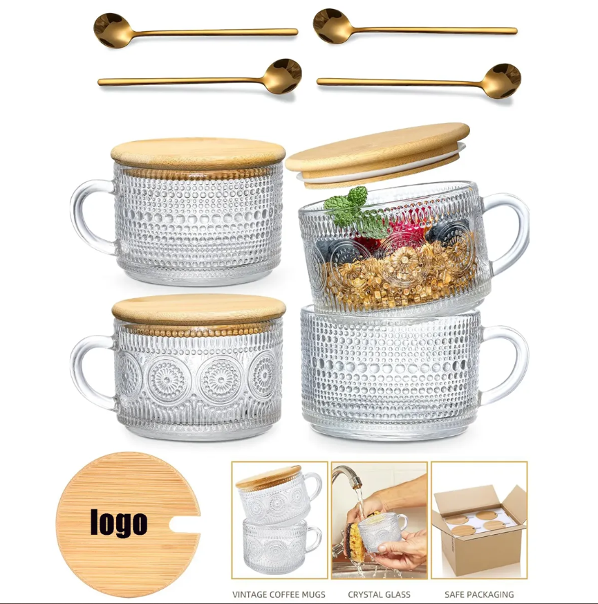 Clear glass mugs with wooden lids, gold spoons, and a wooden coaster with