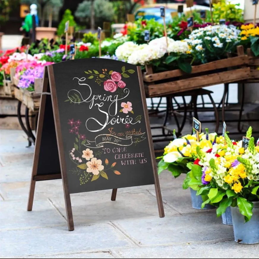 An A-frame chalkboard sign for a