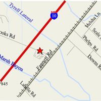 Map showing roads (Fannett Rd, I-10, others) near a star-marked location, with water features.
