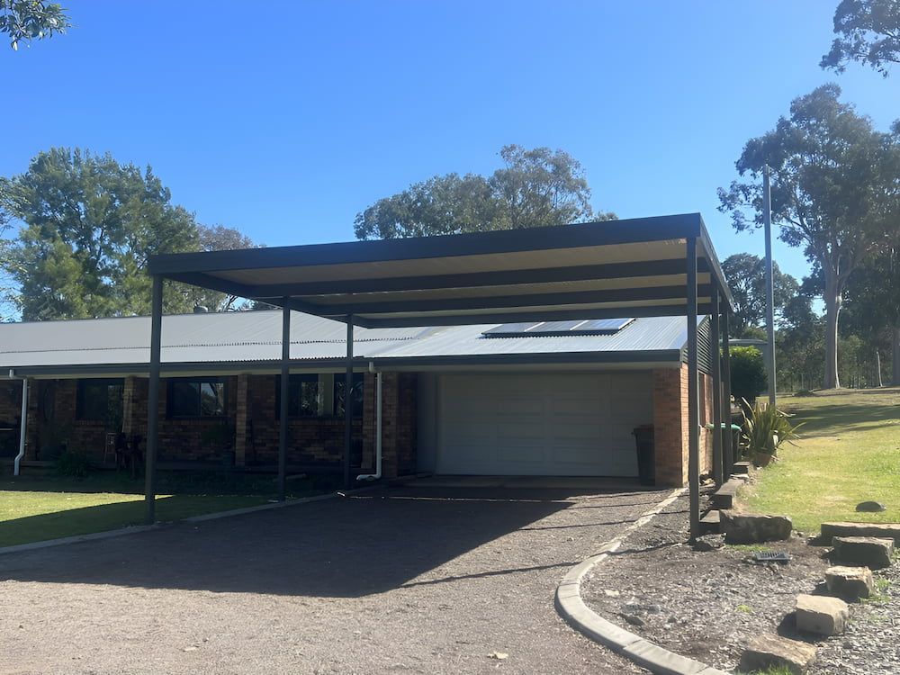 A House With A Carport In Front Of It — Hunter Home Services in Newcastle, NSW