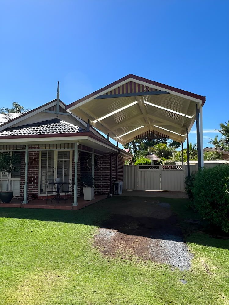 A House With A Carport In Front Of It — Hunter Home Services in Rutherford, NSW