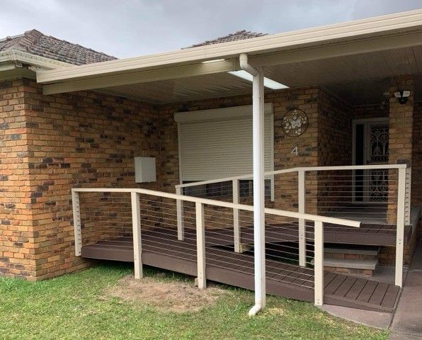 Brick Building with A Ramp Leading to The Entrance; White Railings — Hunter Home Services in Port Stephens, NSW