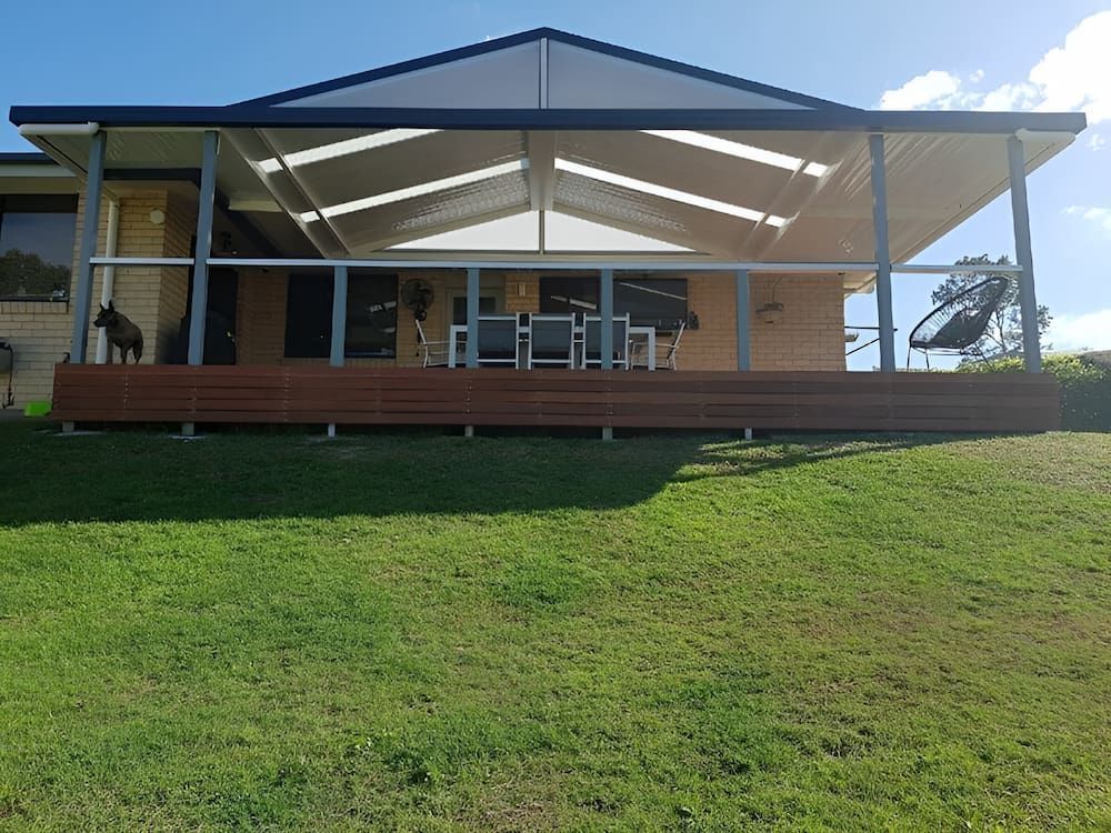 A House With A Large Deck And A Dog On The Porch — Hunter Home Services in Hunter Valley, NSW