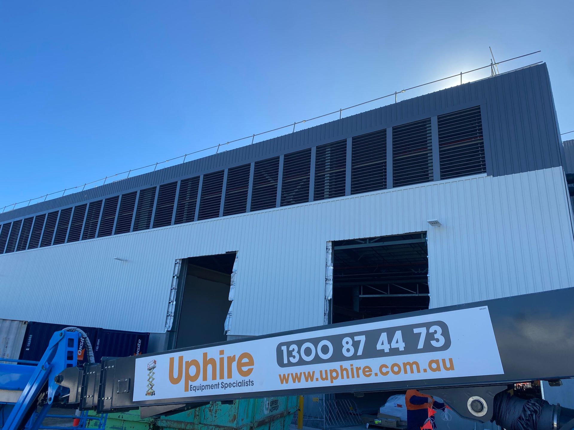 A Large Building with A Sign that Says Uphire on It — Leisure Coast Powder Coaters in Unanderra, NSW