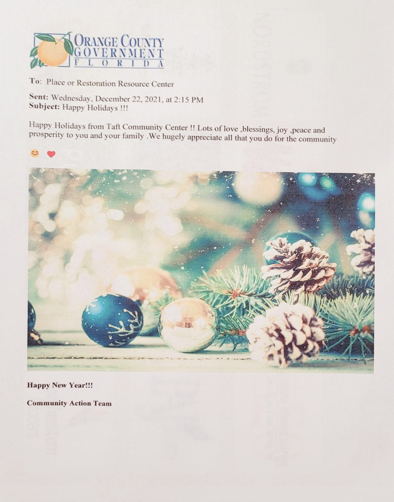 Holiday card from Orange County Government with ornaments and pine cones.