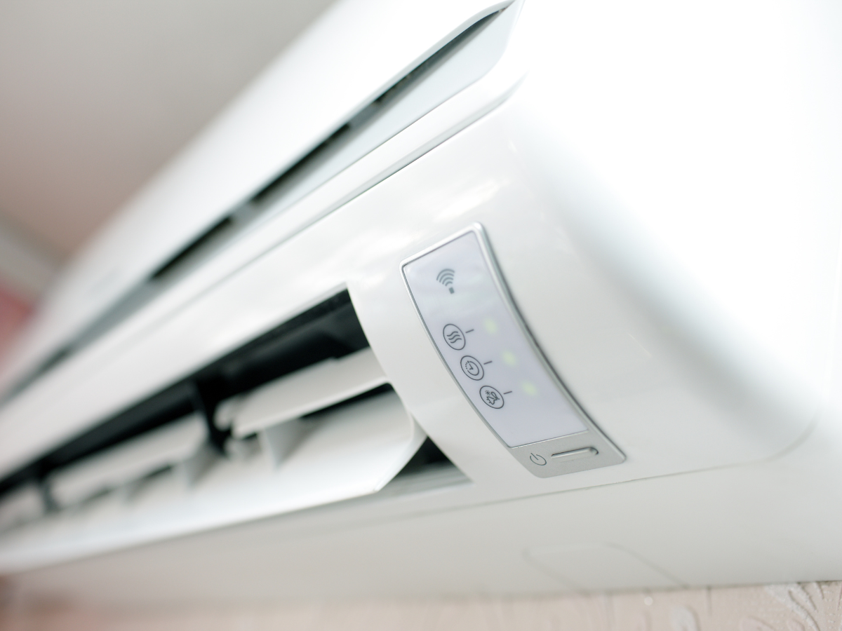 A person is adjusting a thermostat on a radiator. A person is adjusting a thermostat on a radiator.
