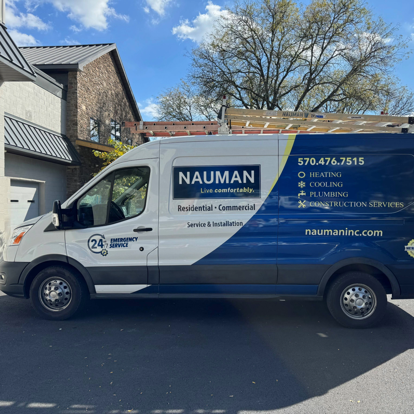 A muddy bobcat with a nauman construction sticker on it