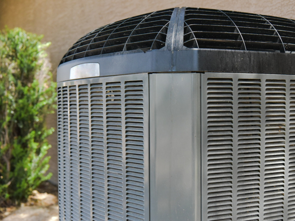 A person is adjusting a thermostat on a radiator. A person is adjusting a thermostat on a radiator.
