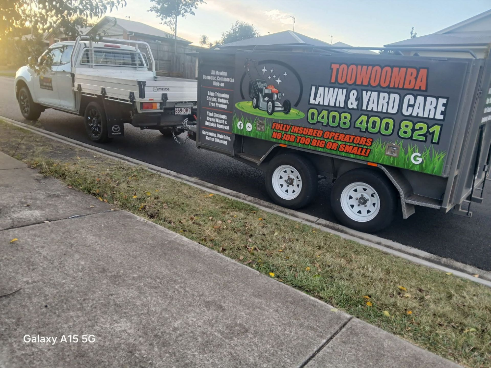 Flatbed Trailer Loaded With Waste, Towed by a Truck — Toowoomba Lawn and Yard care In Glenvale, QLD