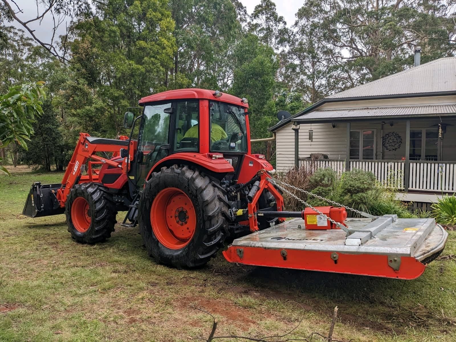 Red Tractor With Front Loader and Mower — Toowoomba Lawn and Yard care In Glenvale, QLD