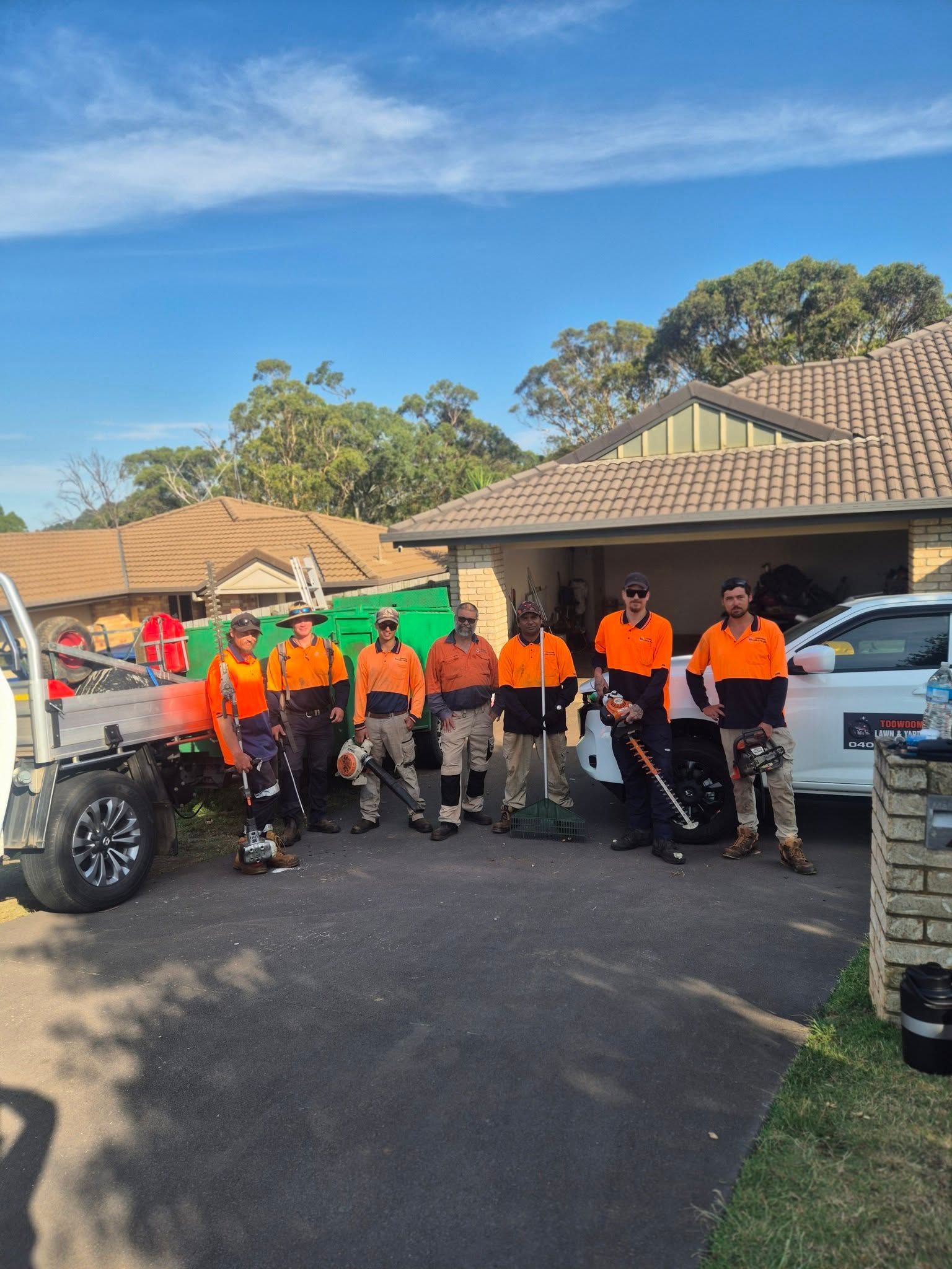 Group of Workers in Orange Shirts and Hard Hats — Toowoomba Lawn and Yard care In Glenvale, QLD