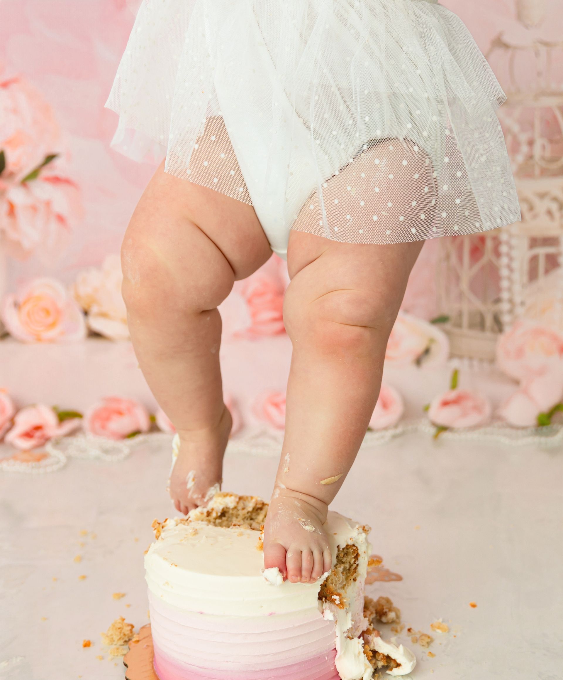 Studio cake smash photography celebrating baby girl’s first birthday in Cary, NC