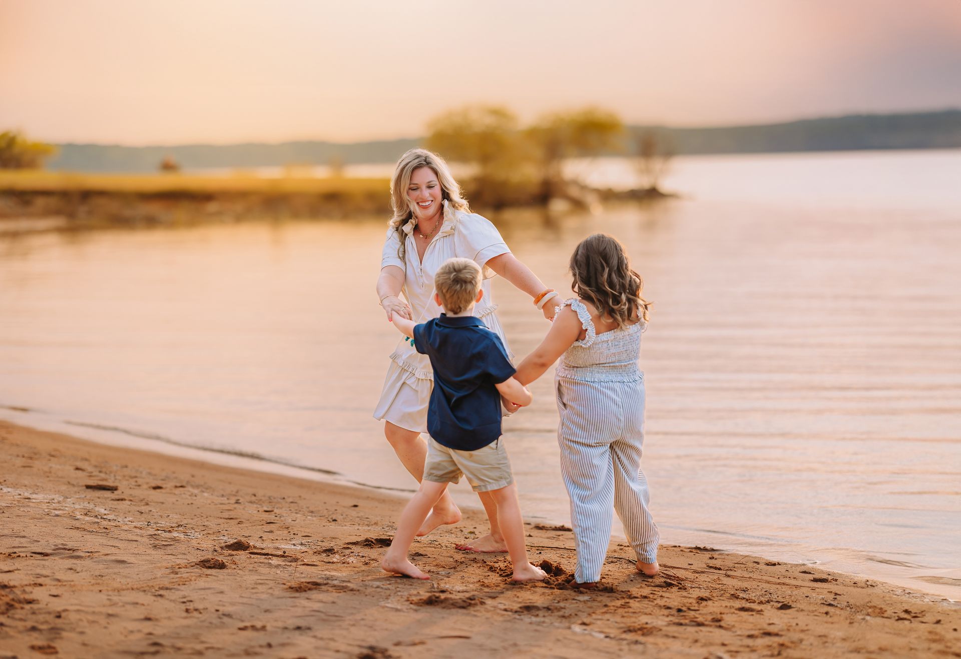 mother and children playing at Jordan lake photoshoot during the golden hour